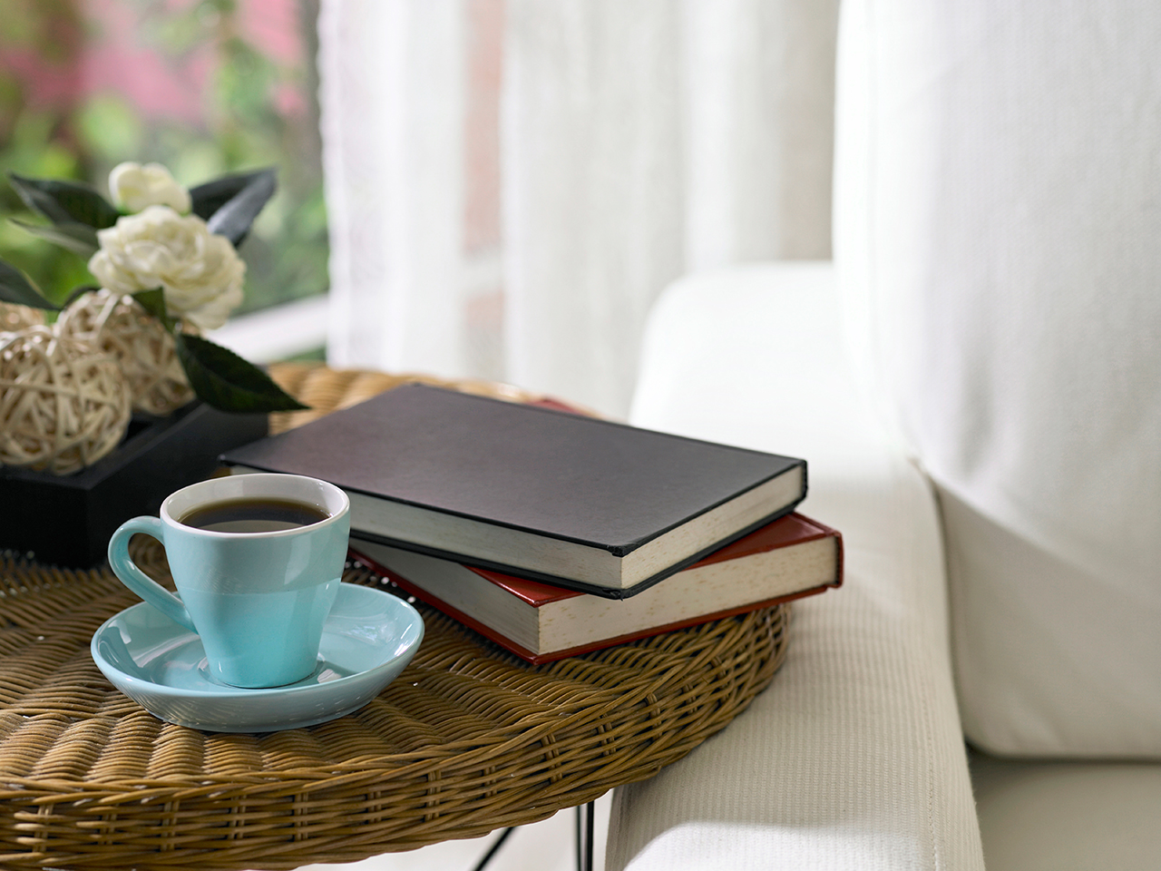 teacup and books on a coffee table